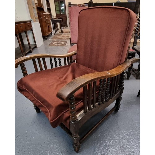 503 - 1930s oak reclining armchair with bobbin turned supports.  (B.P. 21% + VAT)