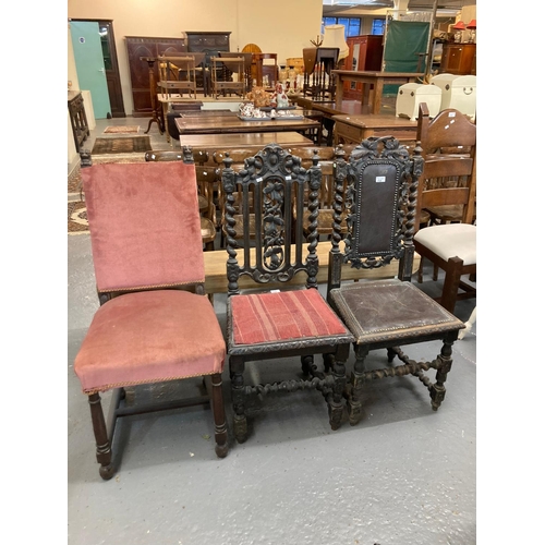 509 - Two similar late Victorian ornately carved oak hall chairs together with another early 20th century ... 