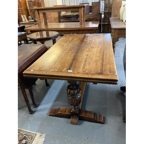 518 - Early 20th century oak extending dining table on large ornately carved and fluted pedestals, shaped ... 