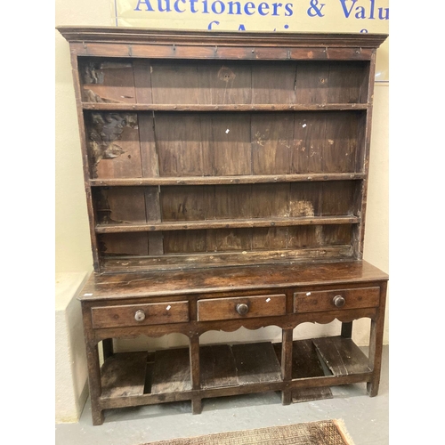 526 - Early 19th century oak two stage rack back dresser, the moulded cornice above a boarded rack with fi... 