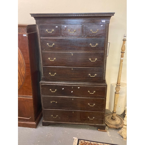 540 - Early 19th century oak chest on chest, the moulded dental cornice above an arrangement of three shor... 