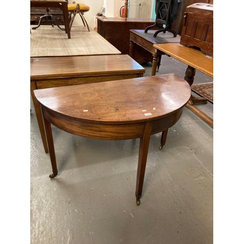 548 - 19th century mahogany Demi lune side table on square tapering legs, brass cups and castors.   (B.P. ... 