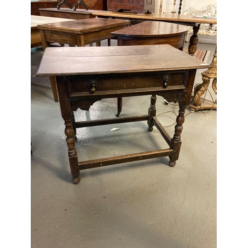 550 - 18th century oak side table, the moulded top above a single drawer with shaped frieze on baluster tu... 