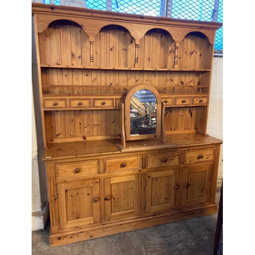 566 - Modern natural pine rack back dresser with spice drawers and four cupboards to the base.  Together w... 