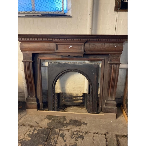 578 - Edwardian mahogany architectural fire surround with associated cast iron grate.  (B.P. 21% + VAT)