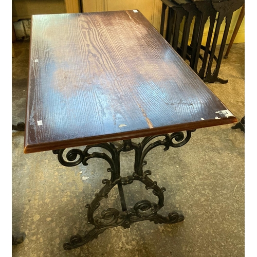 590 - Vintage oak top pub table with ornately scroll decorated cast iron base.   (B.P. 21% + VAT)