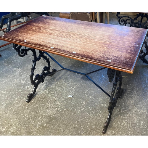 592 - Vintage oak top pub table with ornately scroll decorated cast iron base.   (B.P. 21% + VAT)