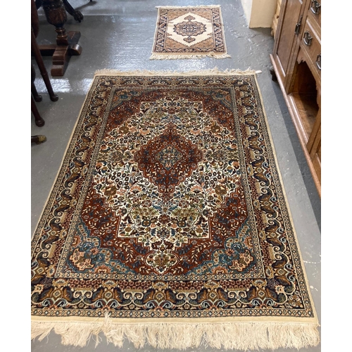 596 - Persian design multi-coloured floral and foliate carpet with central medallion together with a small... 