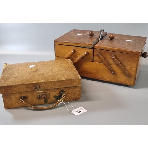 87 - Mid century folding ladies sewing box with accessories together with a small miniature leather suitc... 