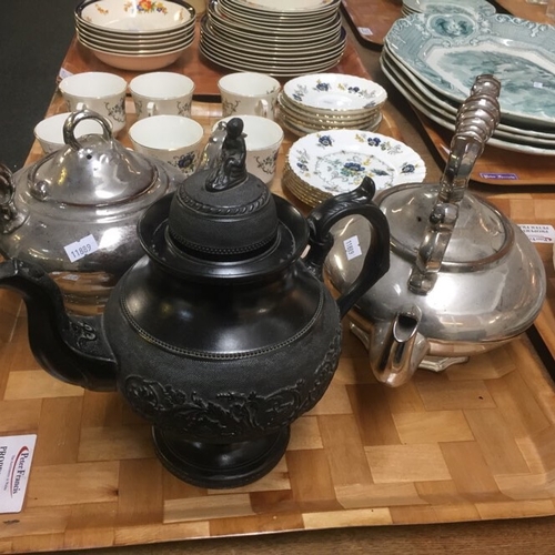 435 - Three teapots: one black basalt teapot with girl knop and pedestal base and two silvered ceramic tea... 