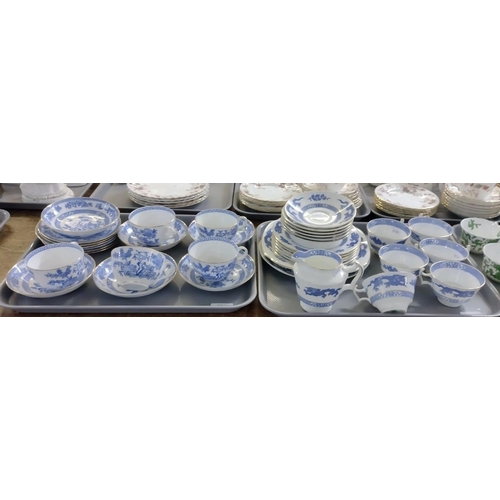 393 - Two trays of blue and white china teaware to include: Orchid design teacups and saucers and small pl... 