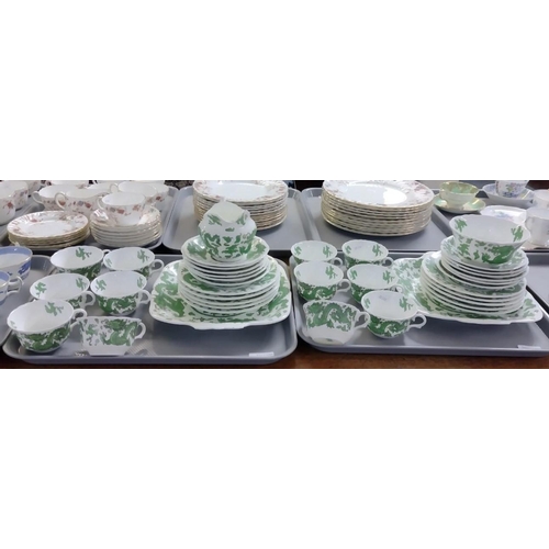 394 - Two trays of Coalport green dragon design tea and dinnerware to include: teacups and saucers, sugar ... 