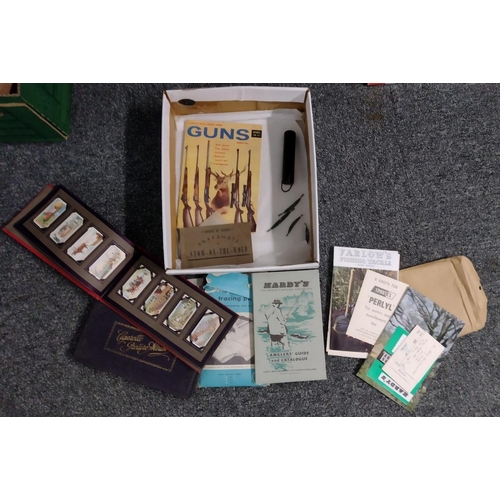 399 - Box of various ephemera to include: Singer sewing machine manual, Simplicity tracing paper, two ciga... 