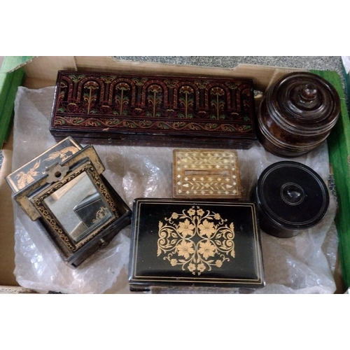 404 - Box of treen boxes to include: two turned wooden tobacco jars (one ebony), a Chinese travelling box ... 