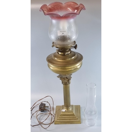 80 - Early 20th century double oil burner lamp now converted to electricity, having clear and frosted cra... 