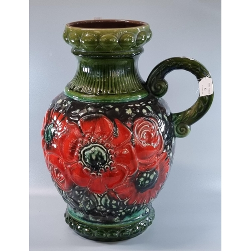 83 - Large West German pottery single handled baluster jug, the body overall decorated with red poppies. ... 