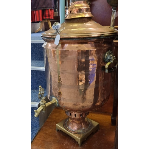 91 - Large Victorian copper and brass lidded samovar with ceramic blue and white handles and brass tap.  ... 