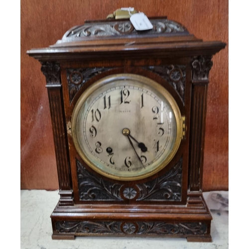 94 - Late 19th/early 20th century ornately carved walnut two train bracket clock with key and pendulum ap... 