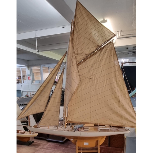 101 - Large authentic model of a single mast yacht.  125cm high and 120cm long approx.  (B.P. 21% + VAT)