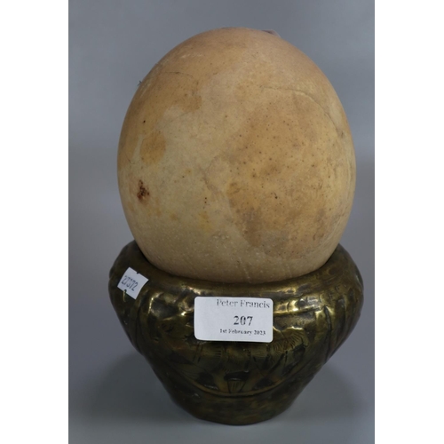 207 - Large Ostrich egg with an Indian brass bowl.  (2)   (B.P. 21% + VAT)