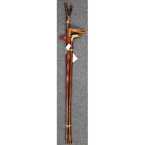 213 - Four walking sticks to include: thumb stick, horse's head stick, crocodile shaped hardwood stick and... 