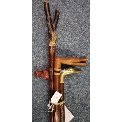 213 - Four walking sticks to include: thumb stick, horse's head stick, crocodile shaped hardwood stick and... 