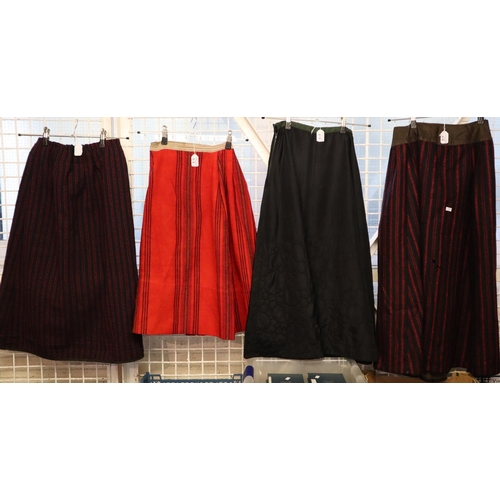 218 - Four antique (probably late 19th Century) skirts to include: three traditional Welsh costume woollen... 