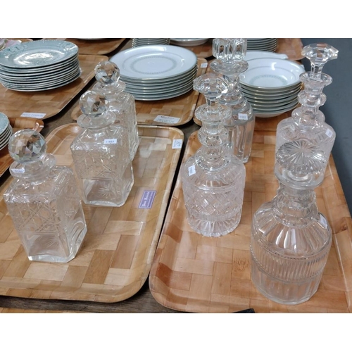 459 - Two trays of glass decanters to include: three matching with star cut bases, various cut and moulded... 