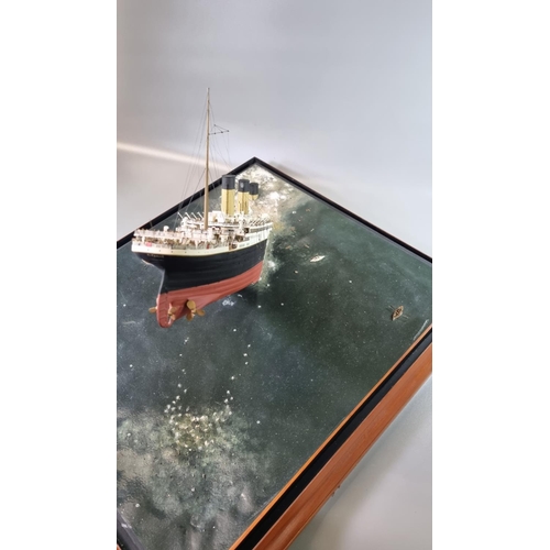 95 - Modern cased diorama of 'The sinking of the Titanic', the top with a painted porthole and the sides ... 