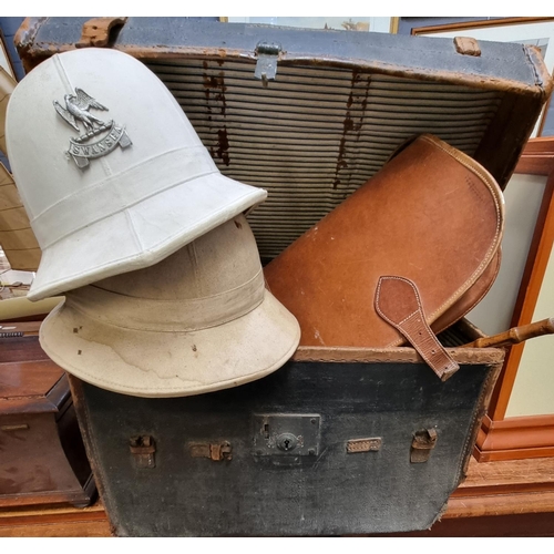 96 - Vintage steam boat trunk, the interior comprising two pith helmets, one with Swansea military badge,... 