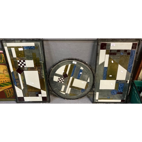 162 - A pair of rectangular stained glass window panels with geometric decoration, together with another s... 