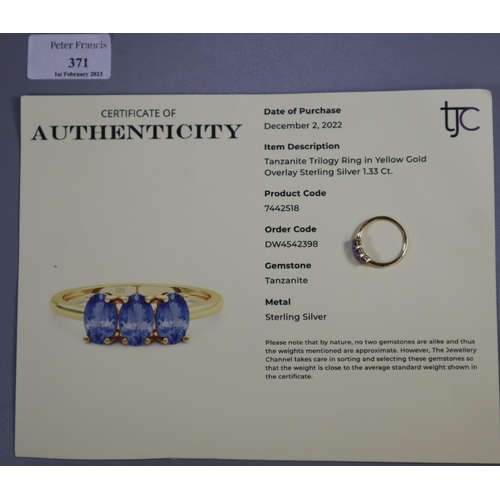 371 - Modern Tanzanite trilogy ring in yellow gold overlay sterling silver.  With COA.   (B.P. 21% + VAT)