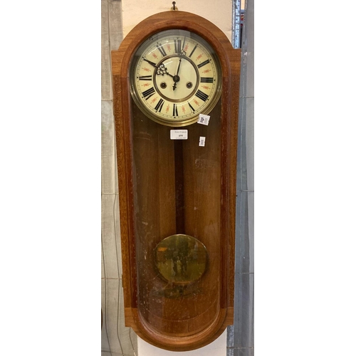 499 - Early 20th Century mahogany two train enamelled wall clock with pendulum.
(B.P. 21% + VAT)