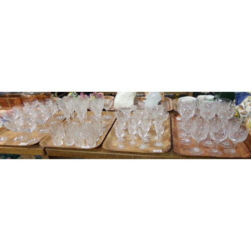 408 - Four trays of assorted cut glass drinking glasses: six etched and cut glass hock glasses, various cu... 