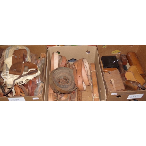 430 - Three boxes of leather goods: many belts and straps, some harness and tack pieces, leather cases and... 