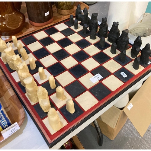 474 - Modern black and white pottery chess set with board.  (B.P. 21% + VAT)