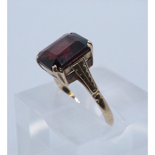 241 - 9ct gold garnet dress ring. Size L + 1/2. 2.2g approx.
(B.P. 21% + VAT)