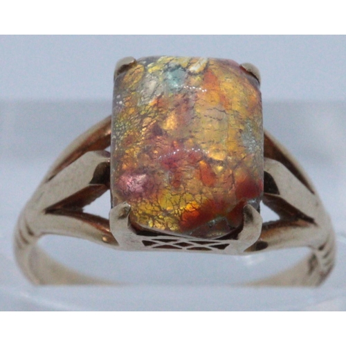 246 - 9ct gold simulated opal rectangular shaped split shank dress ring. Size K, 3.2g approx. 
(B.P. 21% +... 