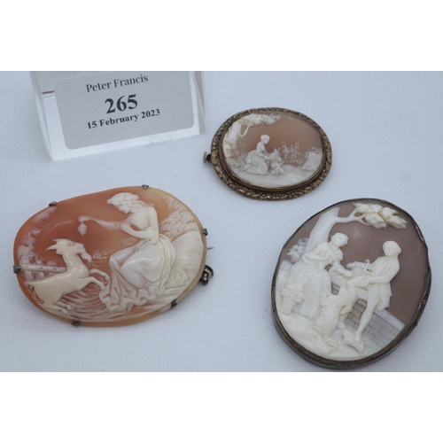 265 - Three carved shell cameo brooches, various. 
(B.P. 21% + VAT)