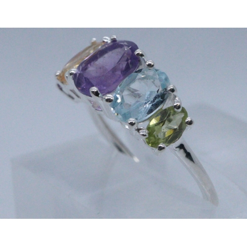 273 - Silver multi-coloured stone dress ring. 
(B.P. 21% + VAT)