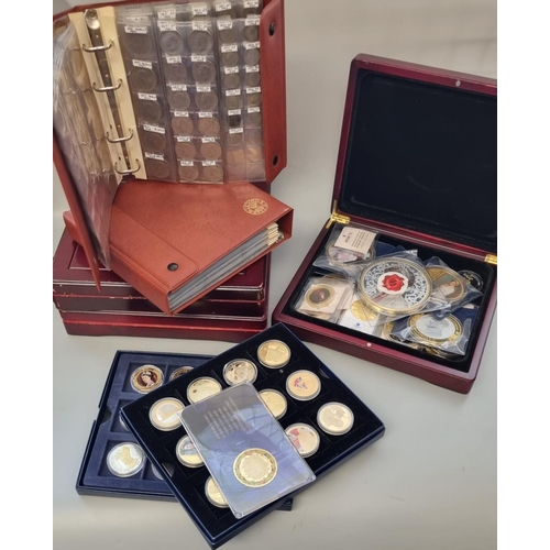 220 - Two albums of GB coinage together with a collection of cased coins, to include: commemorative Prince... 