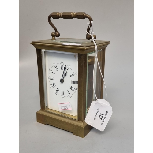 221 - Early 20th century brass carriage clock with enamel face and Roman numerals, with key.  (B.P. 21% + ... 