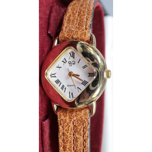 278 - R J W ladies gold plated quartz wristwatch with Roman numerals in original case.  (B.P. 21% + VAT)