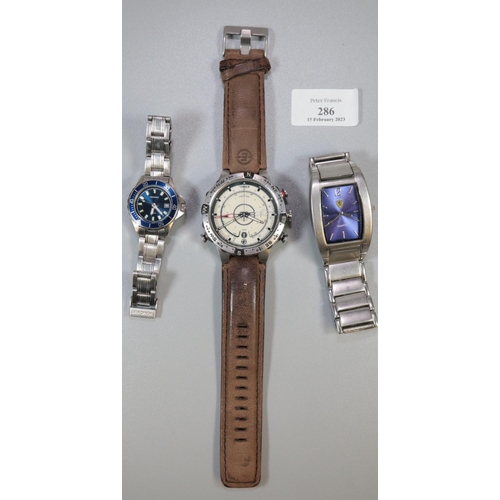 286 - Three modern watches to include; unusual Timex Explorer compass quartz watch with leather strap, a S... 