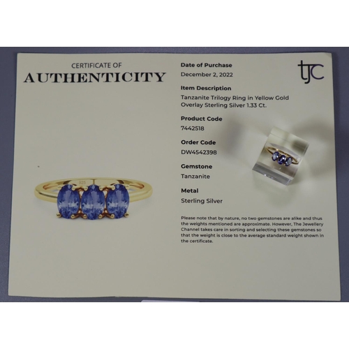 329 - Modern Tanzanite trilogy ring in yellow gold overlay sterling silver.  With COA.   (B.P. 21% + VAT)