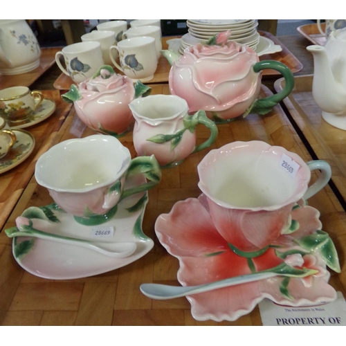 349 - Chinese Floralis porcelain teaware in pink and green adorned with roses: teapot, sucrier, milk jug a... 