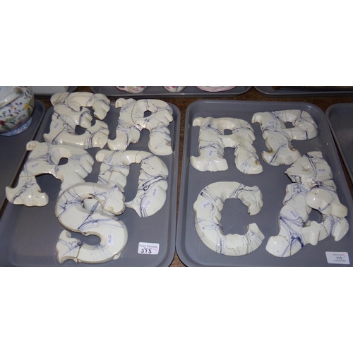 373 - Selection of porcelain high street tradesman's shop letters, white with a blue marbling effect.
(B.P... 