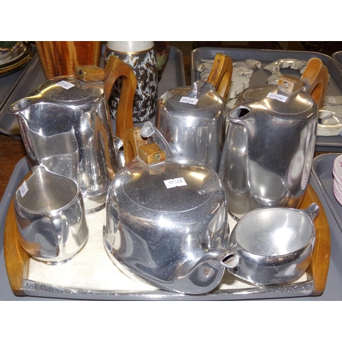 388 - Tray of vintage Picquot Ware: teapot, two coffee pots, water jug, milk jug and sugar basin on a beig... 