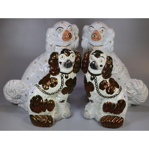 181 - Two pairs of Staffordshire fireside seated spaniels with painted features; one in lustre design. (4)... 