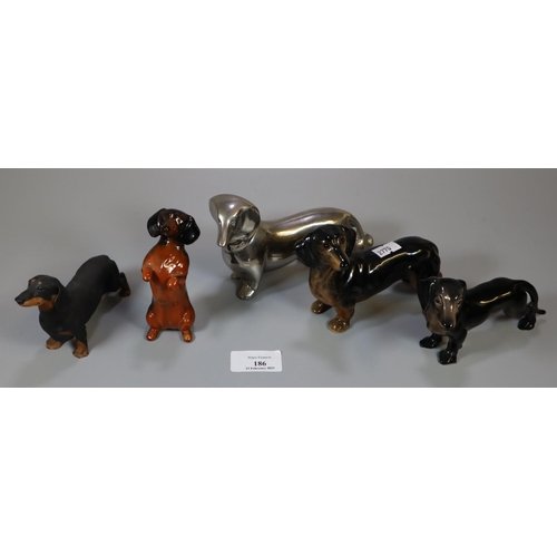 186 - Collection of china Dachshund dogs together with one in metal silver finish.  (5)   (B.P. 21% + VAT)